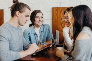 group of people at the coffee table talking